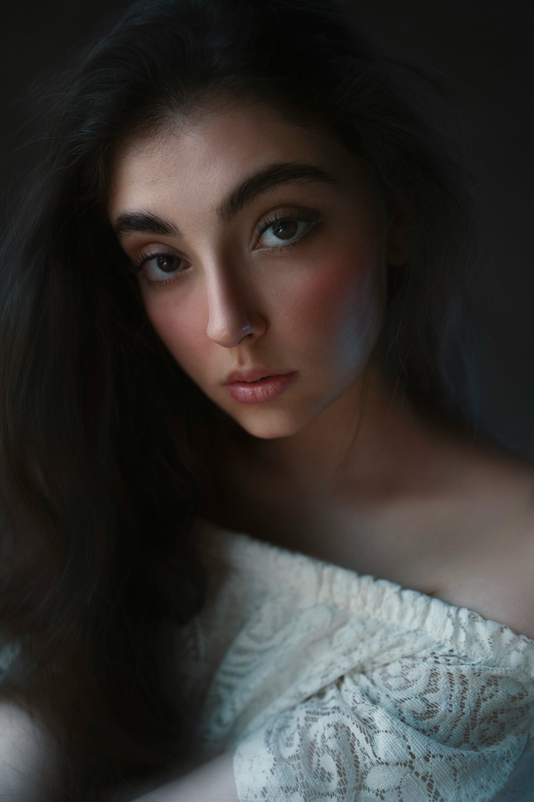 Photo by see plus a woman in a white dress posing for a picture